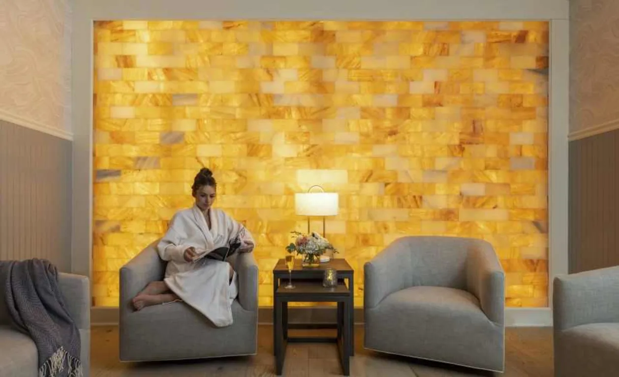 Woman relaxing in front of salt wall at Hotel Viking Spa Fjör